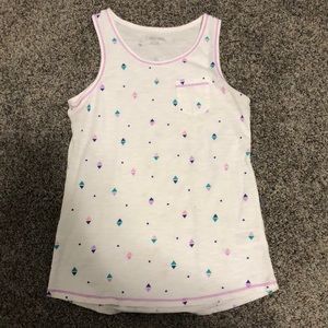 A diamond, and dot patterned tank top.